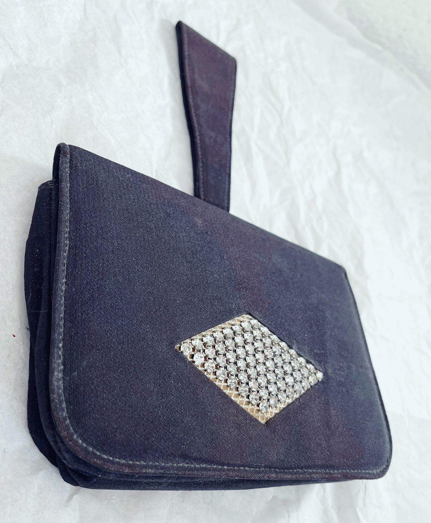 Angled image of bag laid flat against white background.