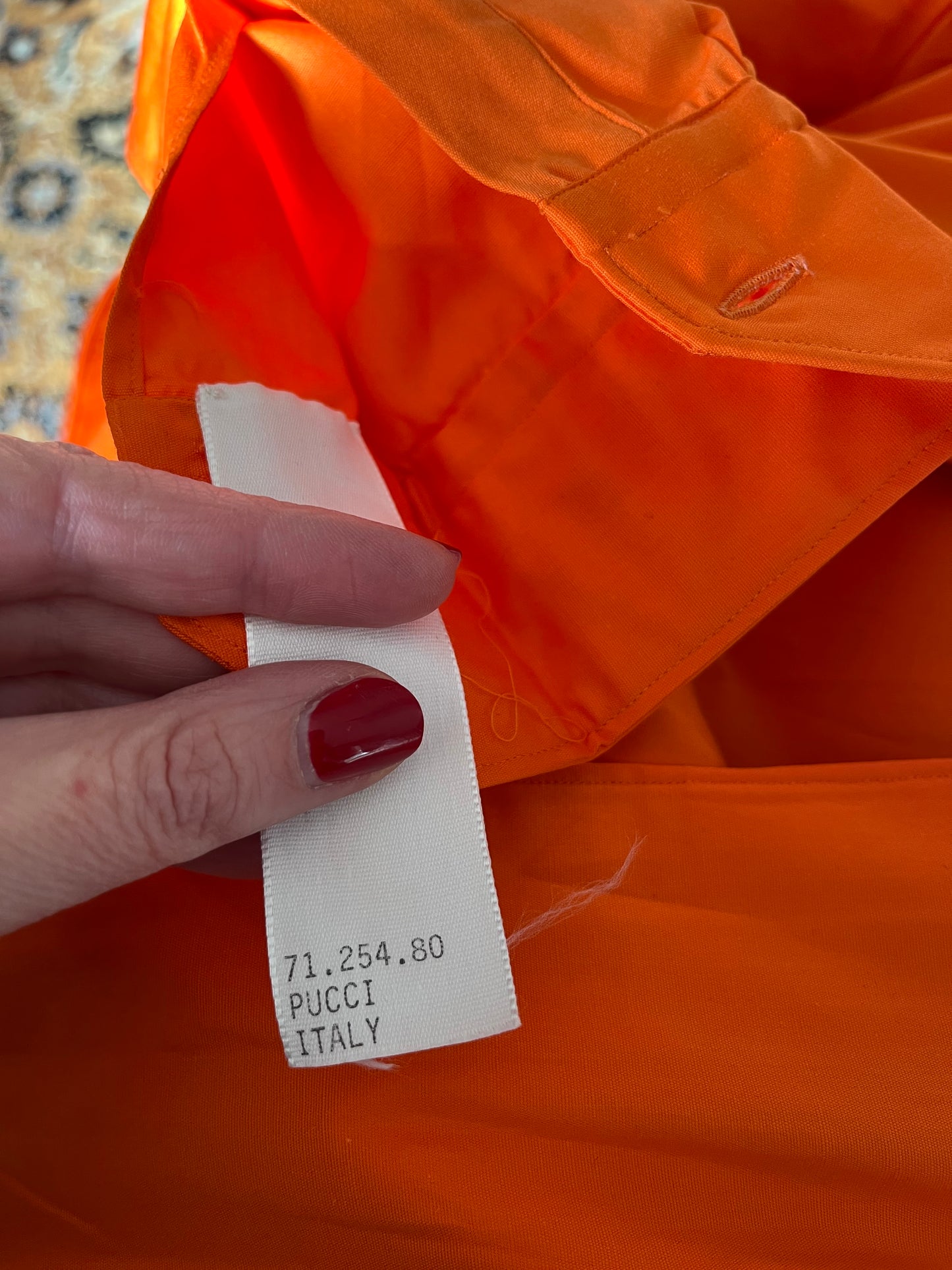 Close up of museum tag which reads "71.254.80 PUCCI ITALY"
